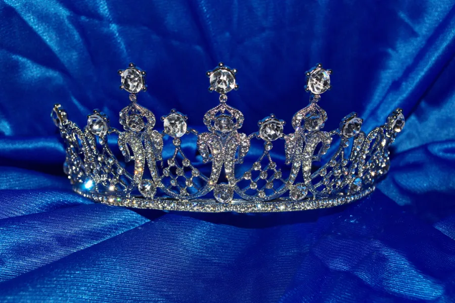 Elegant diamond crown tiara on blue cloth