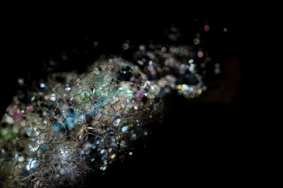 Close-up of soap bubbles against a dark background